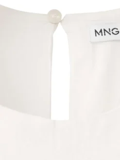 Robe longue blanche unie pourvue d'une coupe évasée et d'un col rond