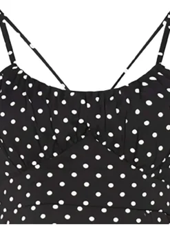 Robe longue noire à pois sans manches avec une coupe droite et un col rond