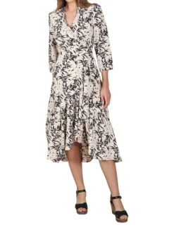 Robe mi-longue blanche imprimé feuille all-over avec une coupe portefeuille et un décolleté cache-coeur