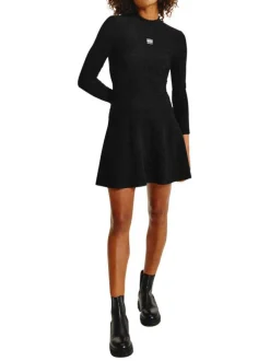 Robe patineuse noire pailleté coupe courte à col montant et manches longues