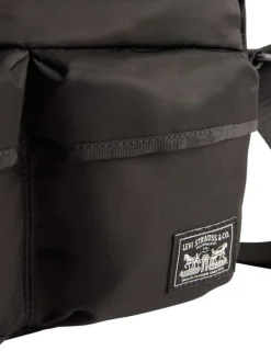 Sac à bandoulière noir orné du nom de la marque et pourvu de multiples poches