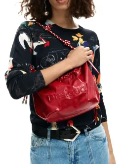 Sac bandouliere rouge uni pourvu d'une anse bicolore tressée