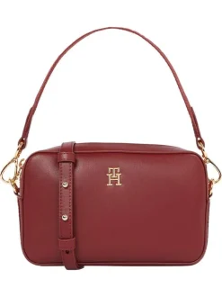 Sac bandoulière bordeaux uni avec un zip de fermeture et logo iconique