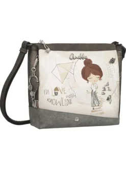 Sac à bandoulière écru imprimé avec un logo de la marque métallique à l'avant