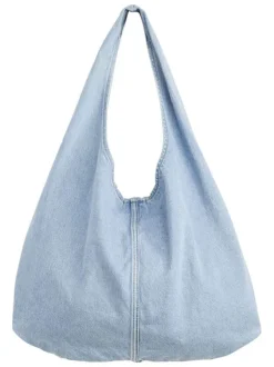 Sac bandoulière en coton bleu clair denim uni avec une fermeture bouton-pression