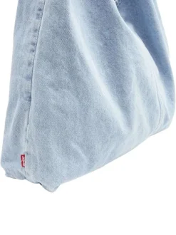 Sac bandoulière en coton bleu clair denim uni avec une fermeture bouton-pression