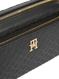 Sac à bandoulière noir pourvu d'une bandoulière amovible et de détails dorés