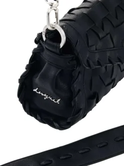 Sac bandoulière noir uni avec un revêtement tressé muni d'une anse