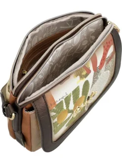 Sac beige avec des imprimés et une bandoulière réglable avec marque cousue
