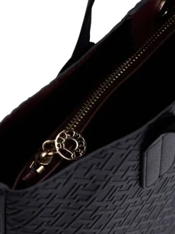 Sac à main marine pourvu d'une bandoulière amovible et d'un bouton à pression