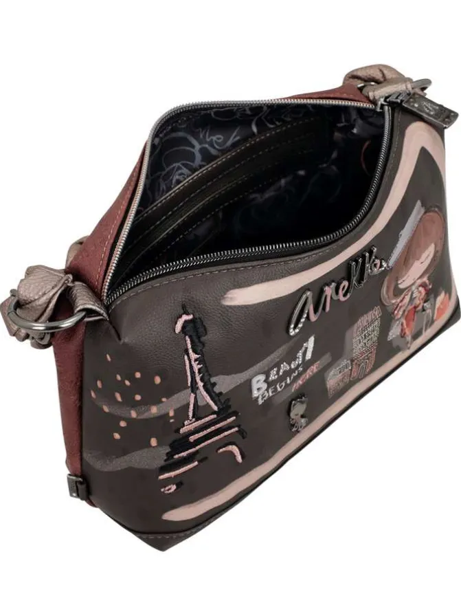 Sac à main marron pourvu de motifs exclusifs et d'une anse tortillée