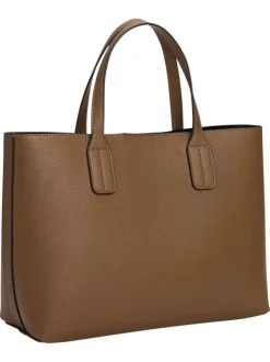 Sac à main marron pourvu d'une bandoulière amovible et d'un bouton à pression