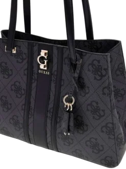 Sac à main noir orné d'un motif monogramme et pourvu d'anses plates