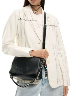 Sac noir uni pourvu d'une anse blanche et noire et d'une bandoulière