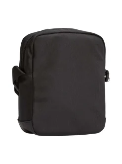 Sacoche noire unie une poche zippée à l'avant et logo iconique