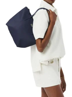 Sac shopping marine pourvu d'une fermeture zippée et du logo de la marque