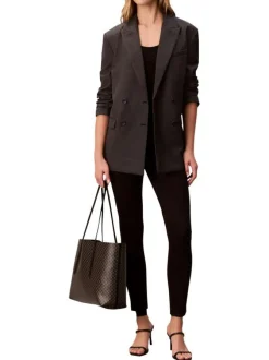 Sac shopping noir avec des motifs monogrammes et muni de deux anses