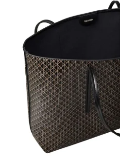 Sac shopping noir avec des motifs monogrammes et muni de deux anses