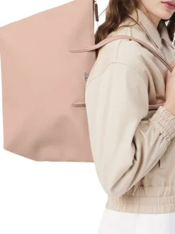 Sac shopping rose pourvu d'une fermeture zippée et du logo de la marque