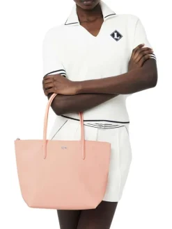 Sac shopping saumon pourvu d'une fermeture zippée et du logo de la marque
