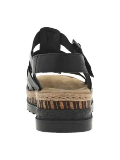 Sandales en cuir noires à talon compensé bas avec une boucle décorative