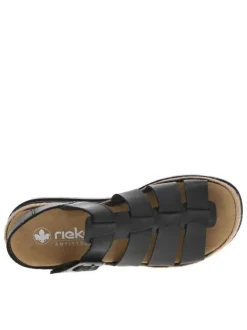 Sandales en cuir noires à talon compensé bas avec une boucle décorative