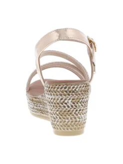 Sandales or roses avec des sangles à strass et à talon compensé