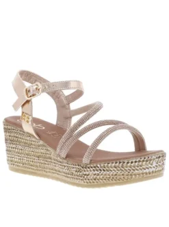 Sandales or roses avec des sangles à strass et à talon compensé