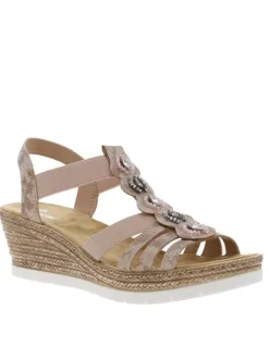 Sandales roses à semelle compensée et à bijoux métalliques sur le dessus