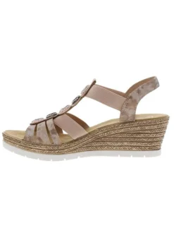 Sandales roses à semelle compensée et à bijoux métalliques sur le dessus