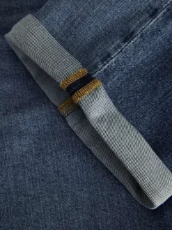 Short 5 poches bleu indigo délavé en coton biologique avec une coupe droite