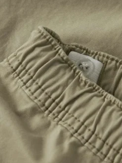 Short chino en coton beige uni pourvu d'une taille élastiquée