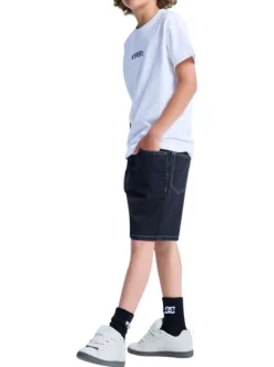 Short en coton noir uni pourvu de multiples poches et d'une coupe baggy