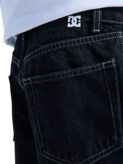 Short en coton noir uni pourvu de multiples poches et d'une coupe baggy