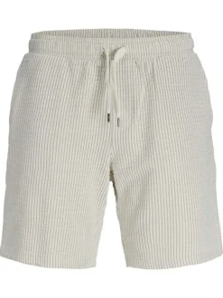 Short beige côtelé pourvu d'une taille élastiquée avec cordon de serrage