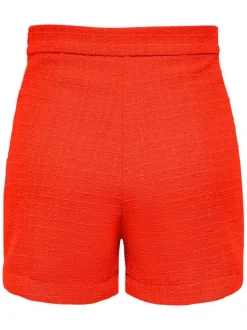 Short chino orange en tweed avec des boutons argentés décoratifs