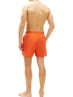 Short de bain orange à coupe ajustée pourvu du nom de la marque