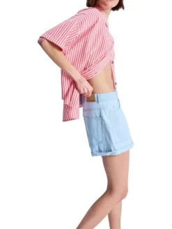 Short en coton bleu à coupe ample pourvu d'une fermeture zippée et boutonnée