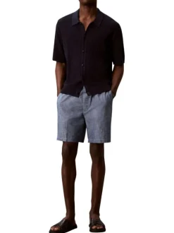Short en coton bleu uni pourvu d'une taille élastiquée et d'une coupe droite