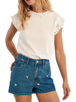Short en coton indigo pourvu de motifs floraux brodés et de multiples poches