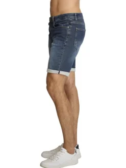 Short en coton indigo à revers pourvu de coutures contrastées