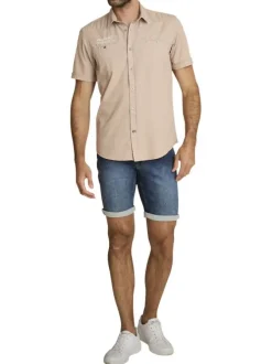 Short en coton indigo à revers pourvu de coutures contrastées