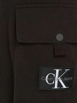 Short en coton noir uni avec une ceinture élastiquée et une coupe cargo