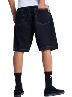 Short en coton noir uni pourvu d'une coupe baggy et de multiples poches