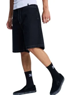 Short en coton noir uni pourvu d'une coupe baggy et de multiples poches