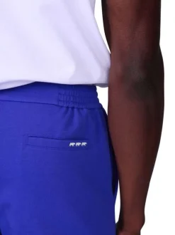 Short jogging bleu uni avec une coupe droite et des poches à l’italienne