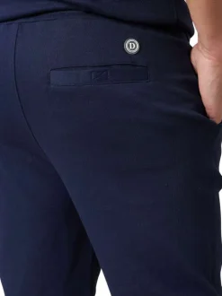 Short jogging en coton mélangé marine uni pourvu d'une coupe droite