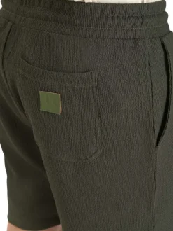 Short jogging kaki uni coupe droite et une taille élastiquée