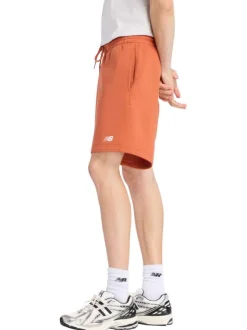 Short jogging orange uni avec une coupe droite et une taille élastique