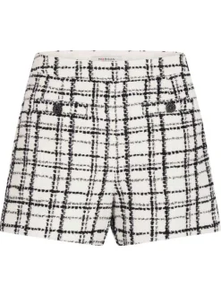 Short noir et blanc à carreaux avec une coupe droite et un zip sur le côté